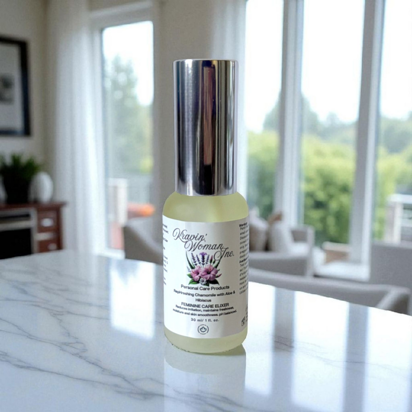 Frosted spray bottle of Kravin Woman Skin Care Product on a marble surface with a blurred indoor background