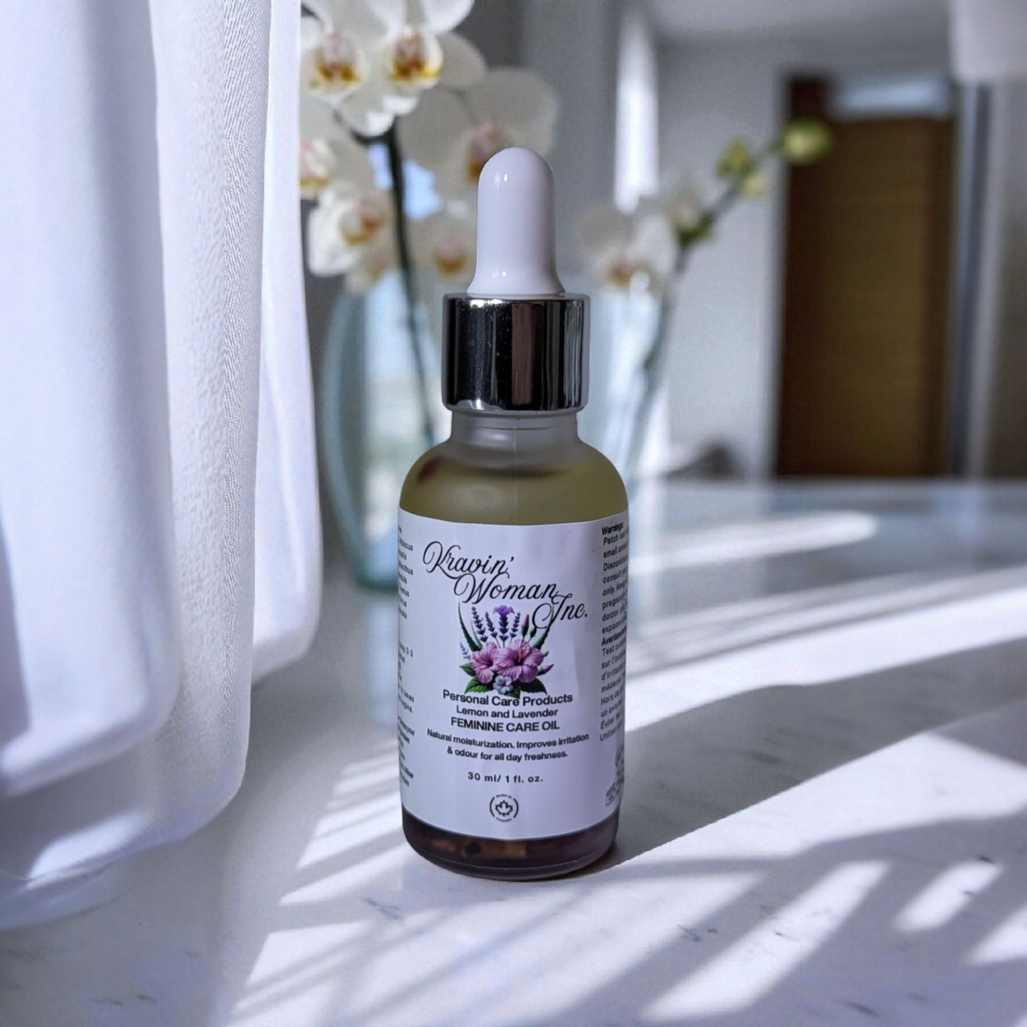 Luxury feminine care oil in frosted glass bottle by Kravin’ Woman Inc., Canada.