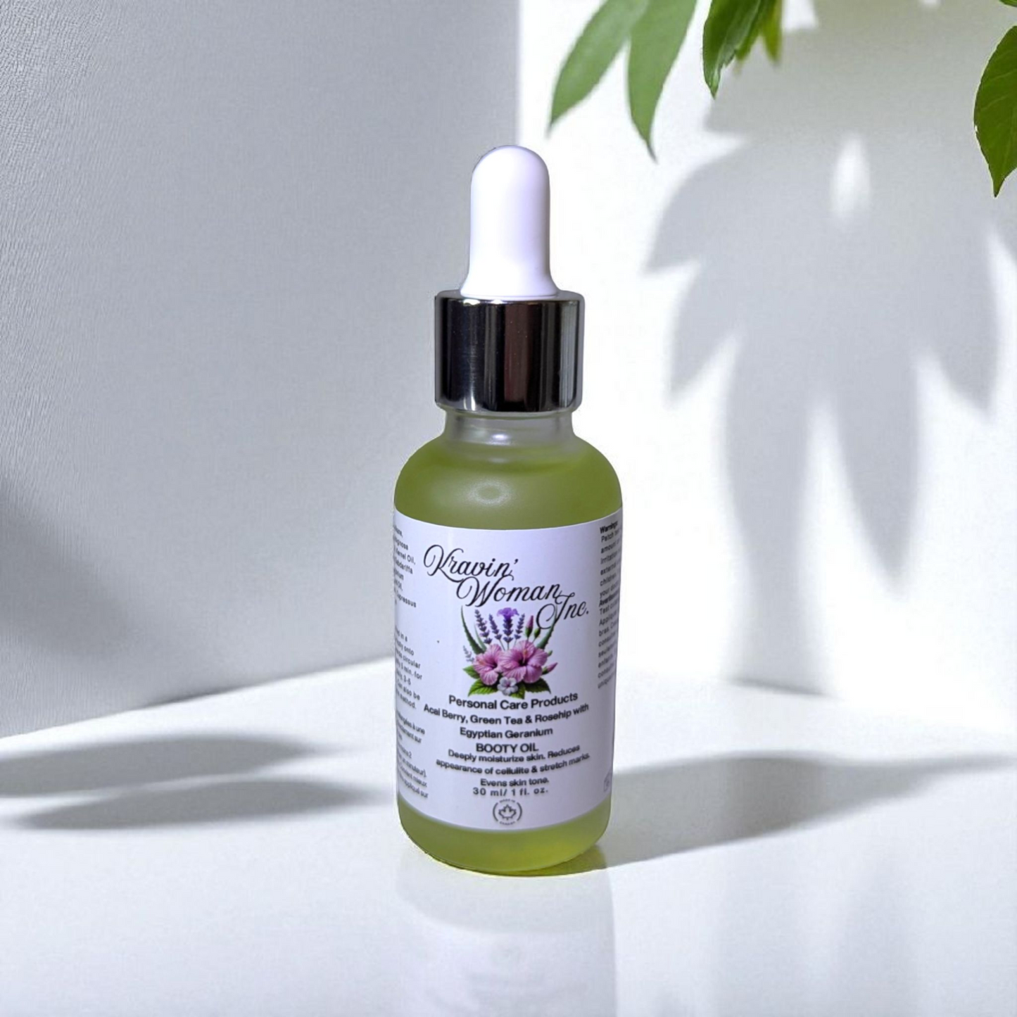 Kravin Woman Inc natural booty oil—brightening and firming sweet tea body oil in handmade luxury packaging; eco-friendly skincare from Calgary, Canada