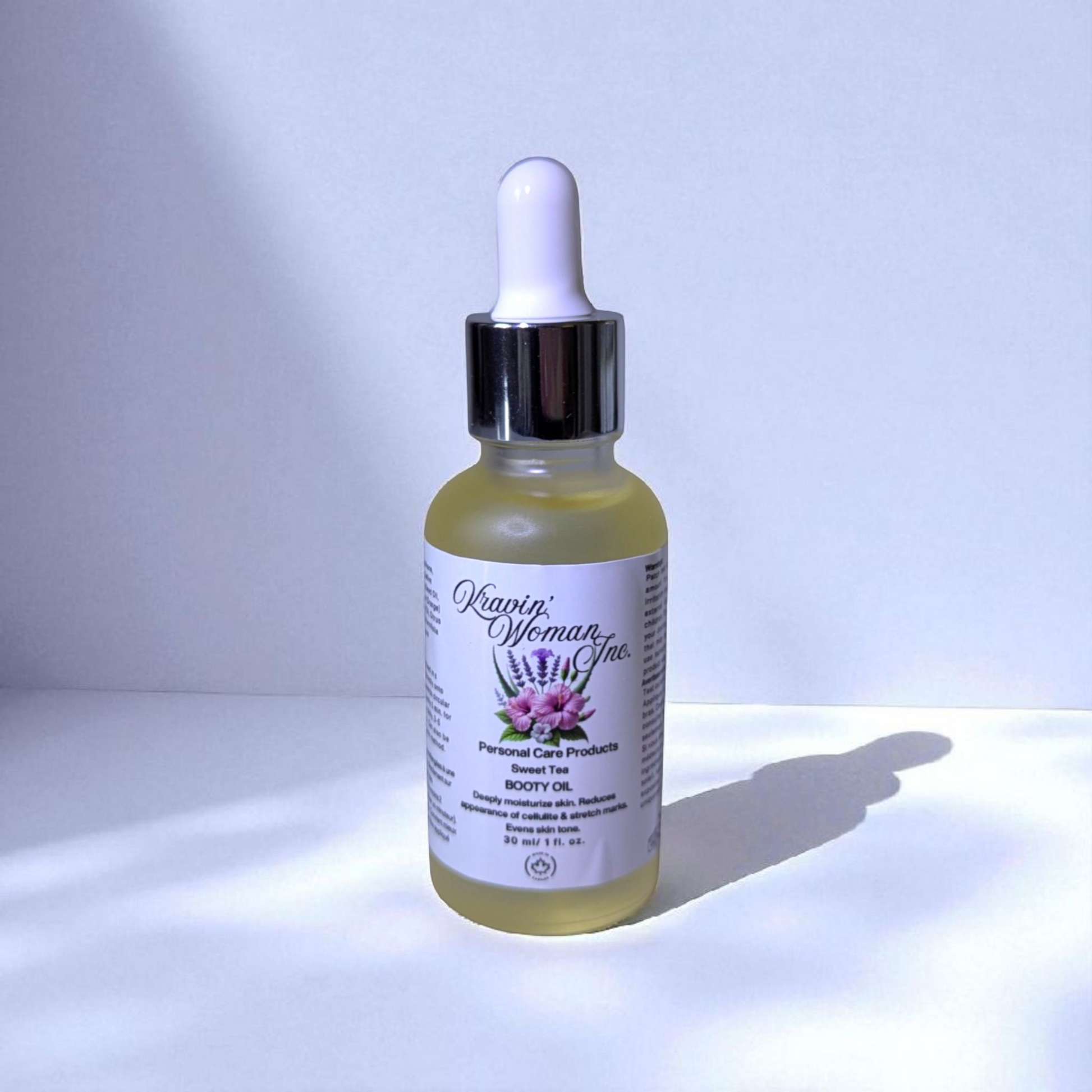 Handmade eco-luxury booty oil by Kravin Woman Inc—sweet tea formula for natural brightening and firming; sustainable skincare from Calgary, Canada.