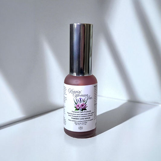 Handmade feminine care serum by Kravin Woman Inc—pineapple and cranberry infused natural intimate care in a luxury frosted bottle; eco-friendly and female-owned in Calgary, Canada. Bottle of Serum with a silver cap on a white surface with shadows