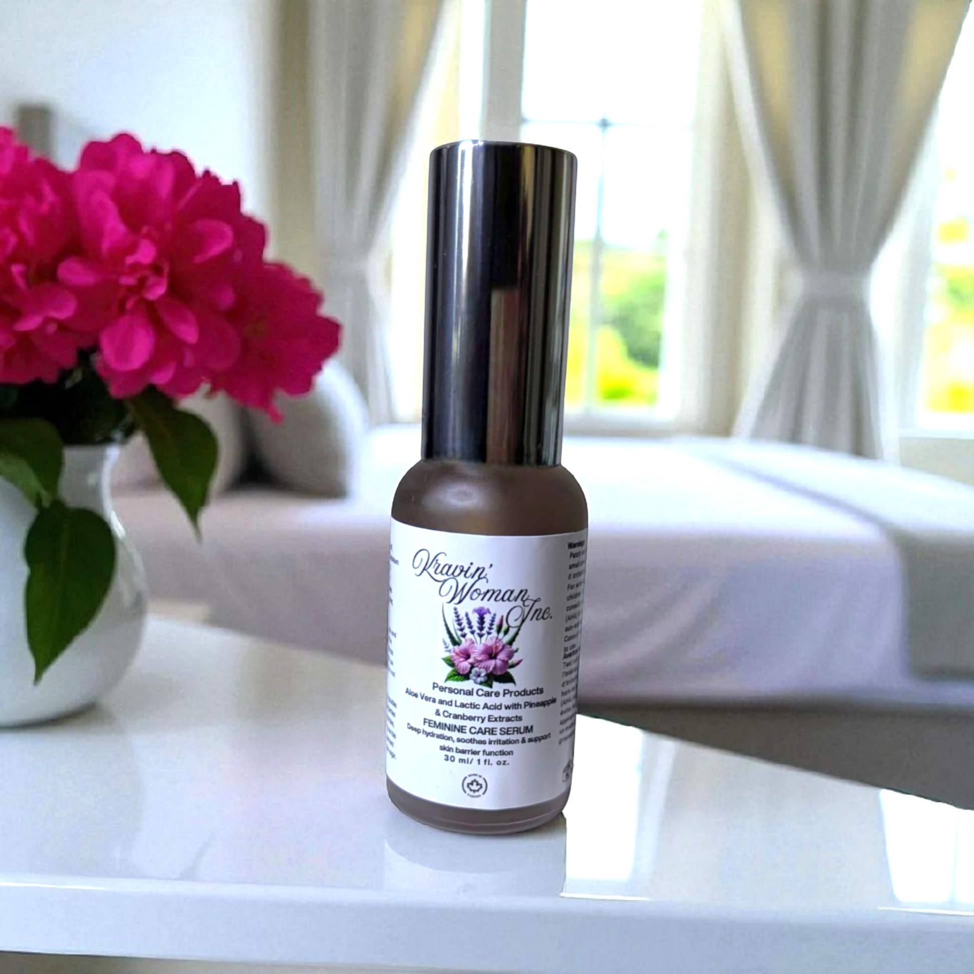 Kravin Woman Inc luxury feminine care serum—natural aloe, lactic acid, pineapple, and cranberry blend in a premium frosted bottle; handmade, eco-friendly, sustainable, female-owned brand in Calgary.