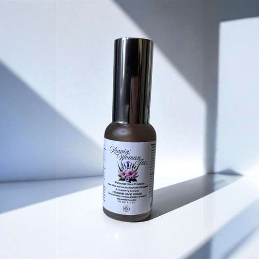 Eco-friendly luxury feminine serum from Kravin Woman Inc—aloe, lactic acid, pineapple, and cranberry infused formula; handmade by a female-owned Calgary skincare brand. frosted glass pump bottle on white countertop with cast shadows. 