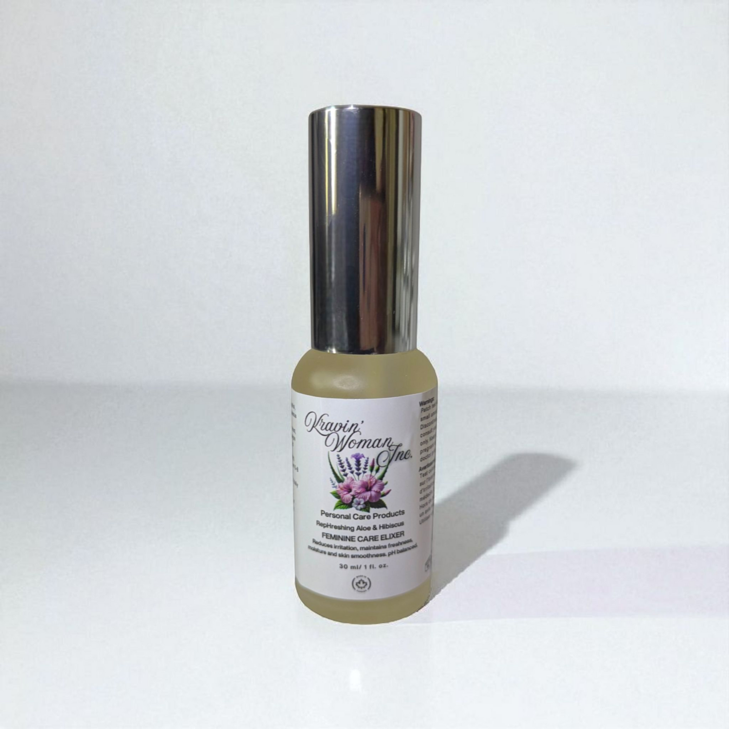 Handcrafted natural yoni elixir from Kravin Woman Inc—aloe, hibiscus, apple cider vinegar, and honey in elegant frosted packaging; luxury Black woman–owned brand based in Calgary, Alberta, Canada.