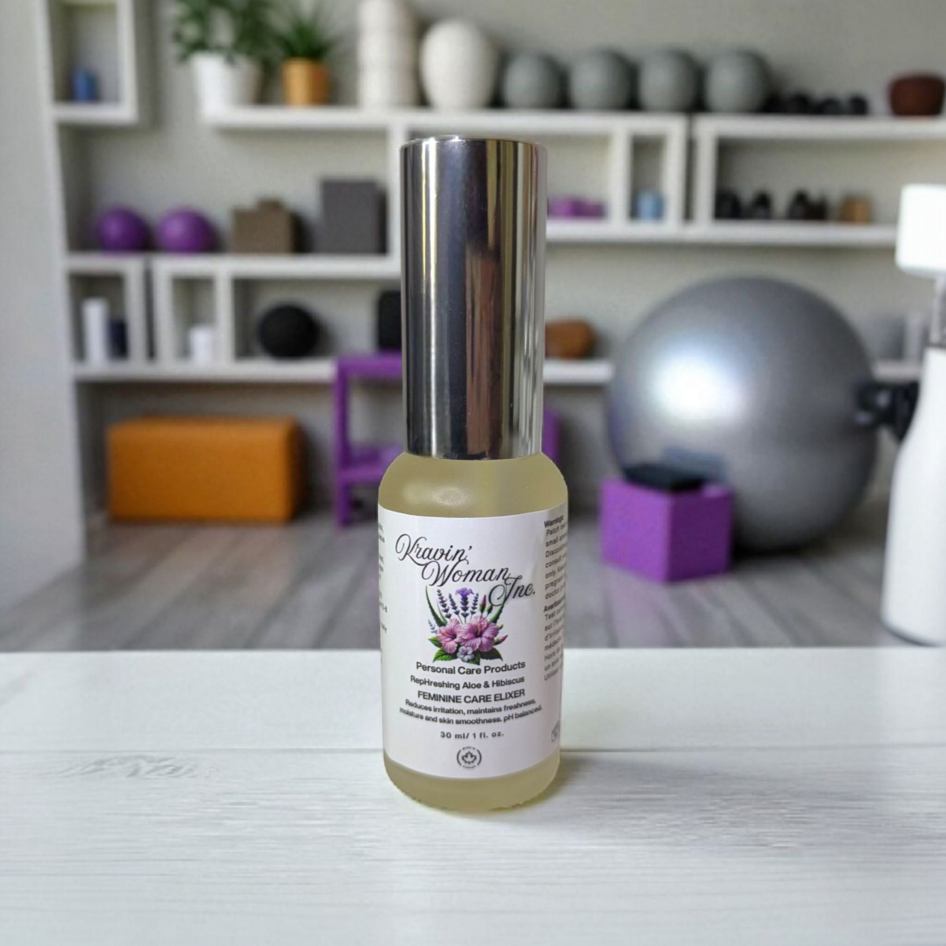 Kravin Woman Inc feminine care elixir—natural aloe, hibiscus, apple cider vinegar, and honey yoni blend in a luxury frosted bottle; handcrafted by a Black woman–owned brand in Calgary, Alberta, Canada.