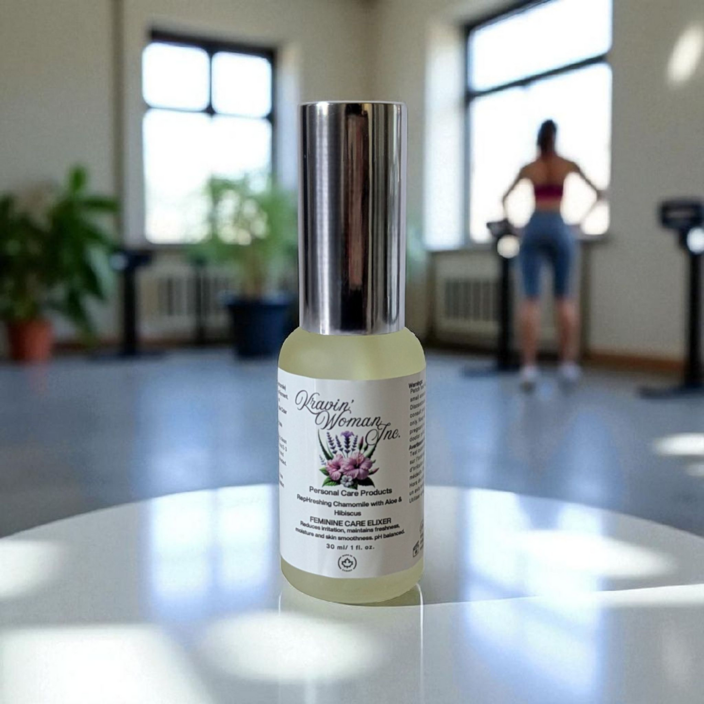 Luxury intimate personal care elixir, frosted glass spray bottle by Kravin Woman Inc—chamomile, aloe, and hibiscus natural feminine formula; handcrafted,  female–owned, Calgary, Alberta