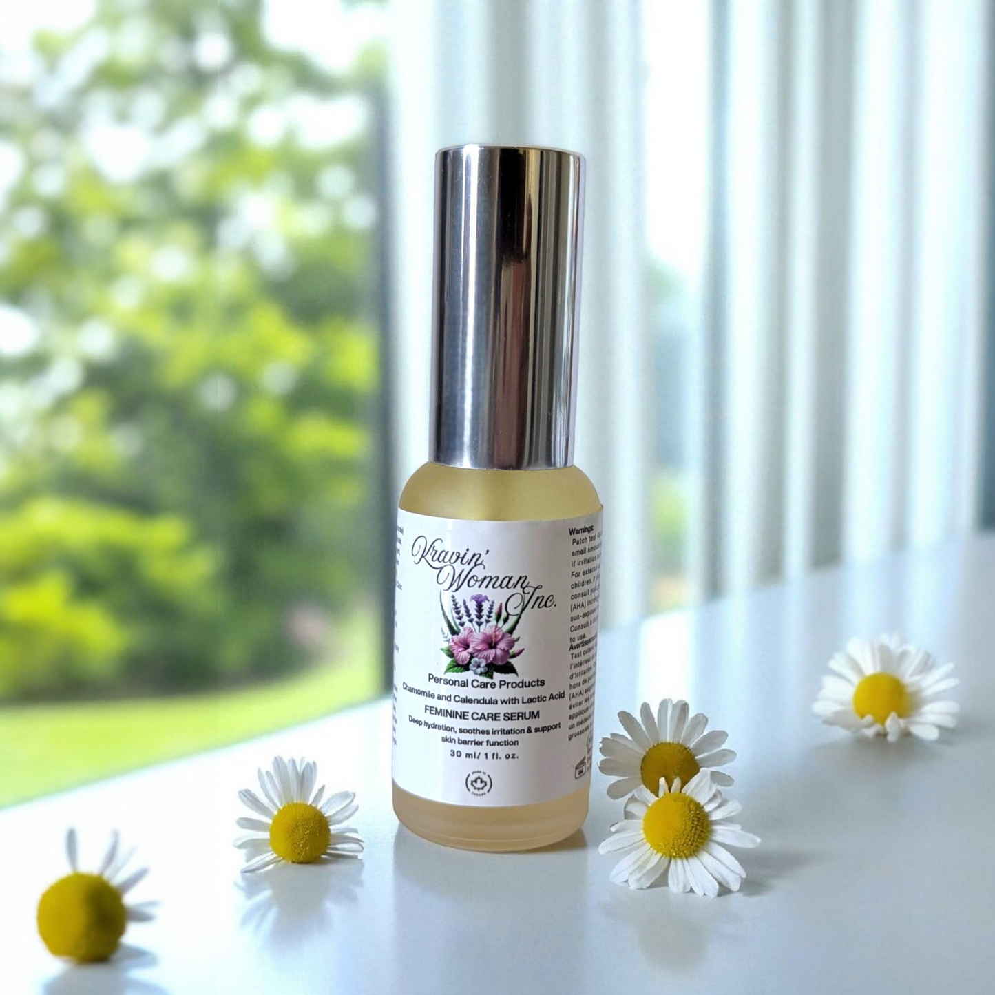 Luxury intimate personal care elixir by Kravin Woman Inc—chamomile, aloe, and hibiscus feminine care blend; natural, handmade, woman-owned skincare from Calgary, Alberta.