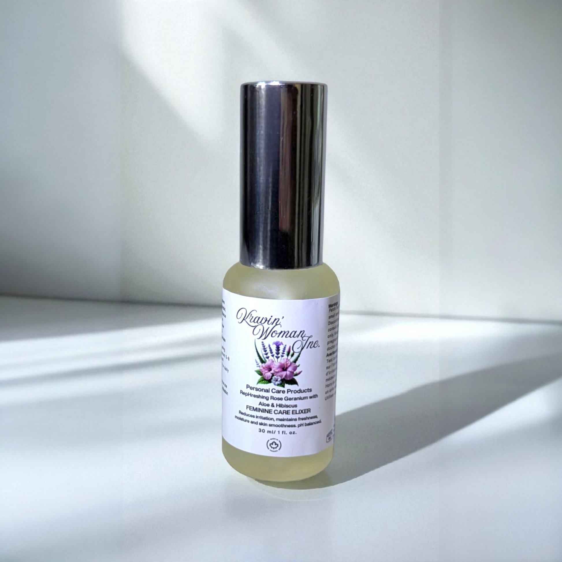 Handcrafted natural yoni elixir from Kravin Woman Inc—rose, aloe, hibiscus, apple cider vinegar, and honey in premium frosted packaging; luxury woman-owned brand in Calgary, Alberta, Canada