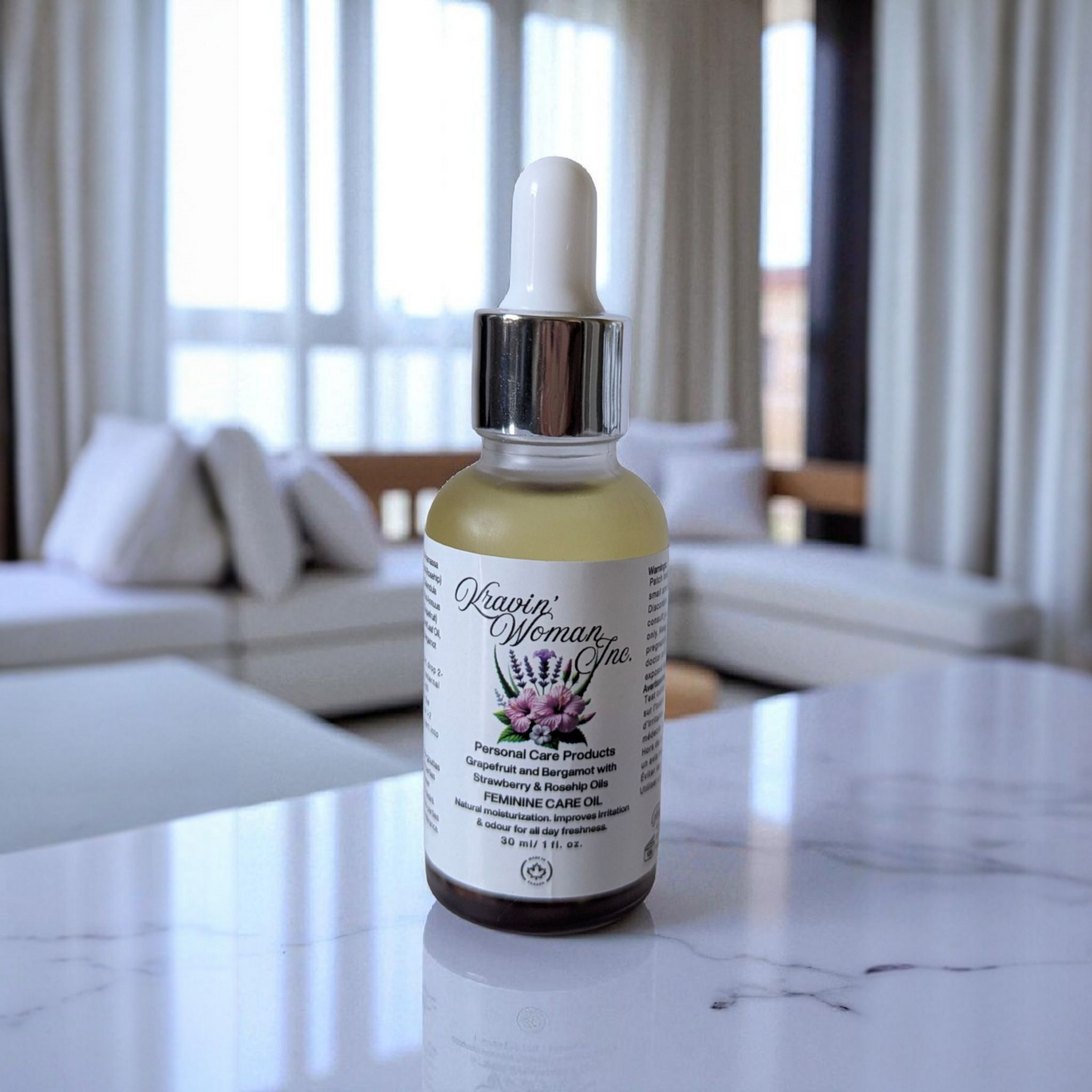 Kravin Woman Inc feminine care oil in a frosted glass bottle—grapefruit and bergamot infused natural yoni hygiene formula with rosehip oil; luxury, handmade, eco skincare crafted in Calgary, Alberta, Canada