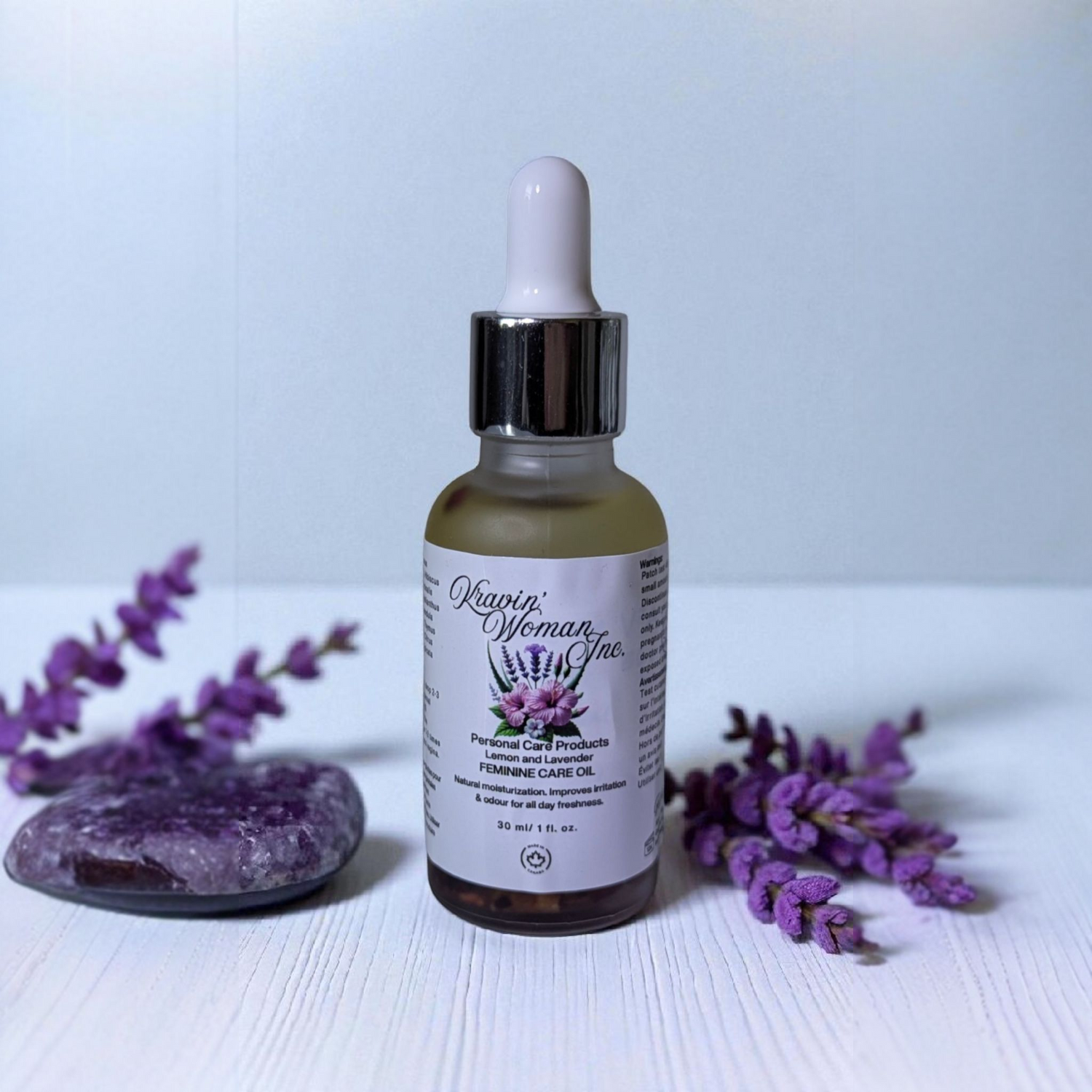 Luxury feminine care oil in frosted glass bottle by Kravin’ Woman Inc., Canada.